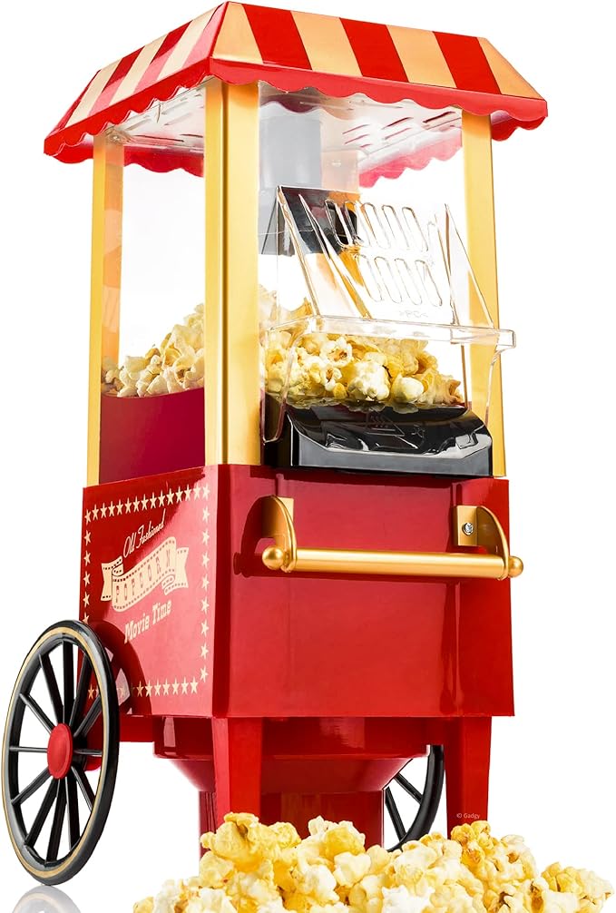Rote Retro-Popcornmaschine im Jahrmarktstil mit Rädern und frischem Popcorn